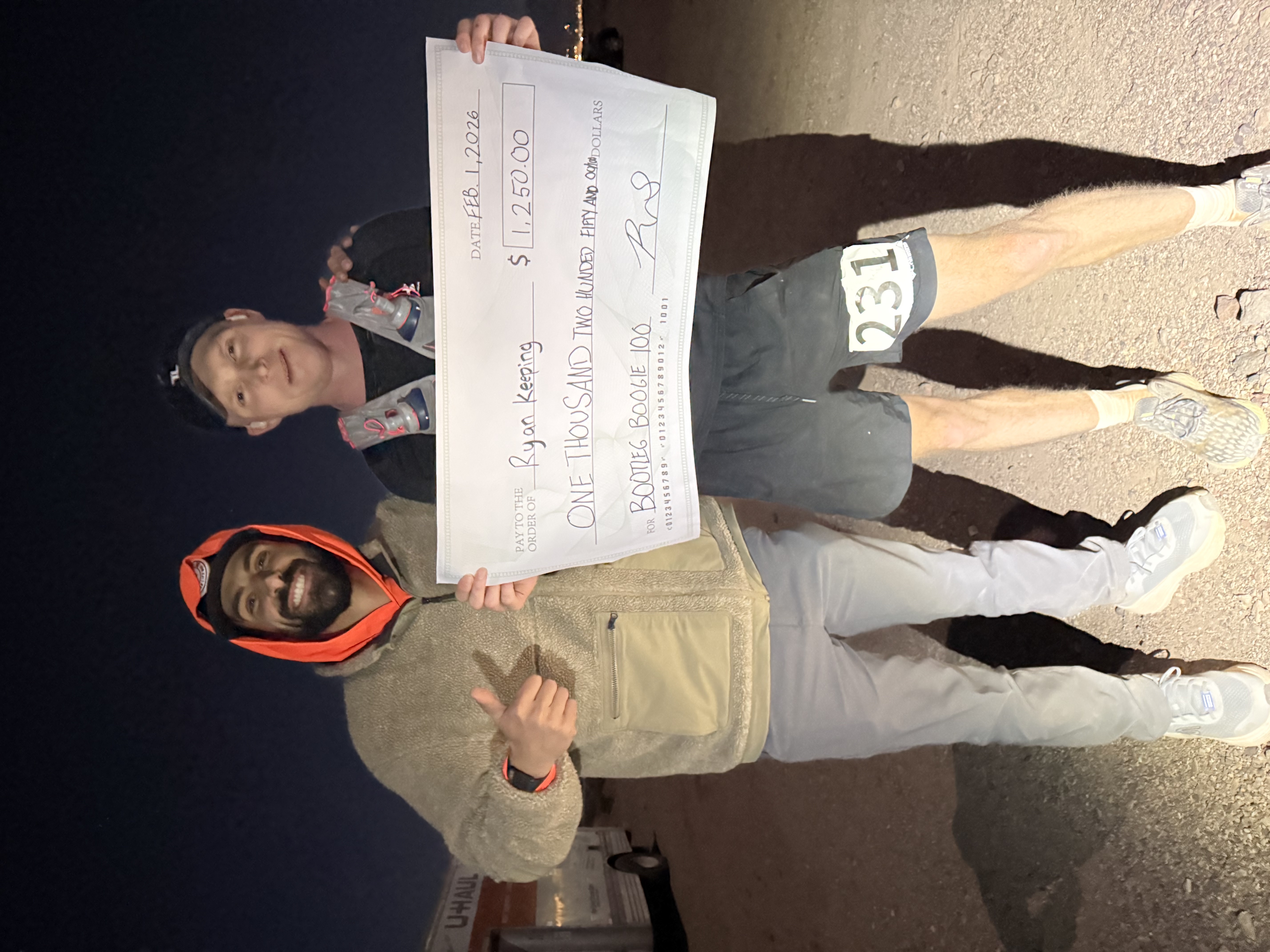 Bootleg Boogie finisher with prize check